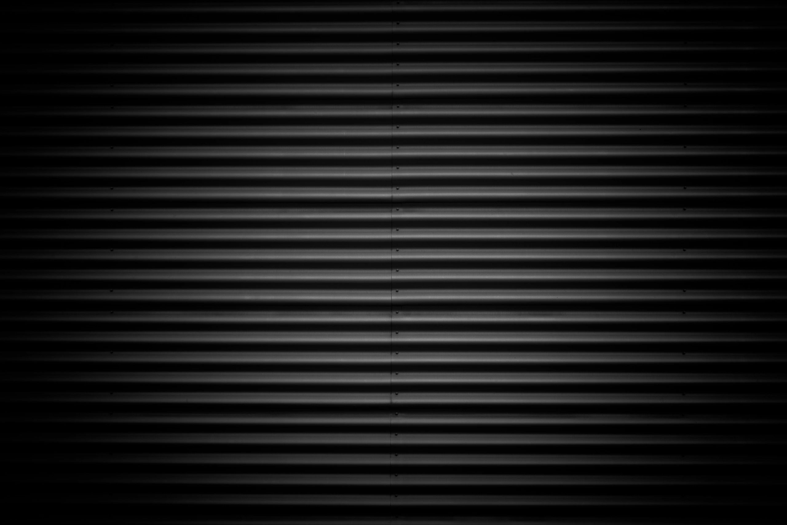 Dark corrugated metal siding detail