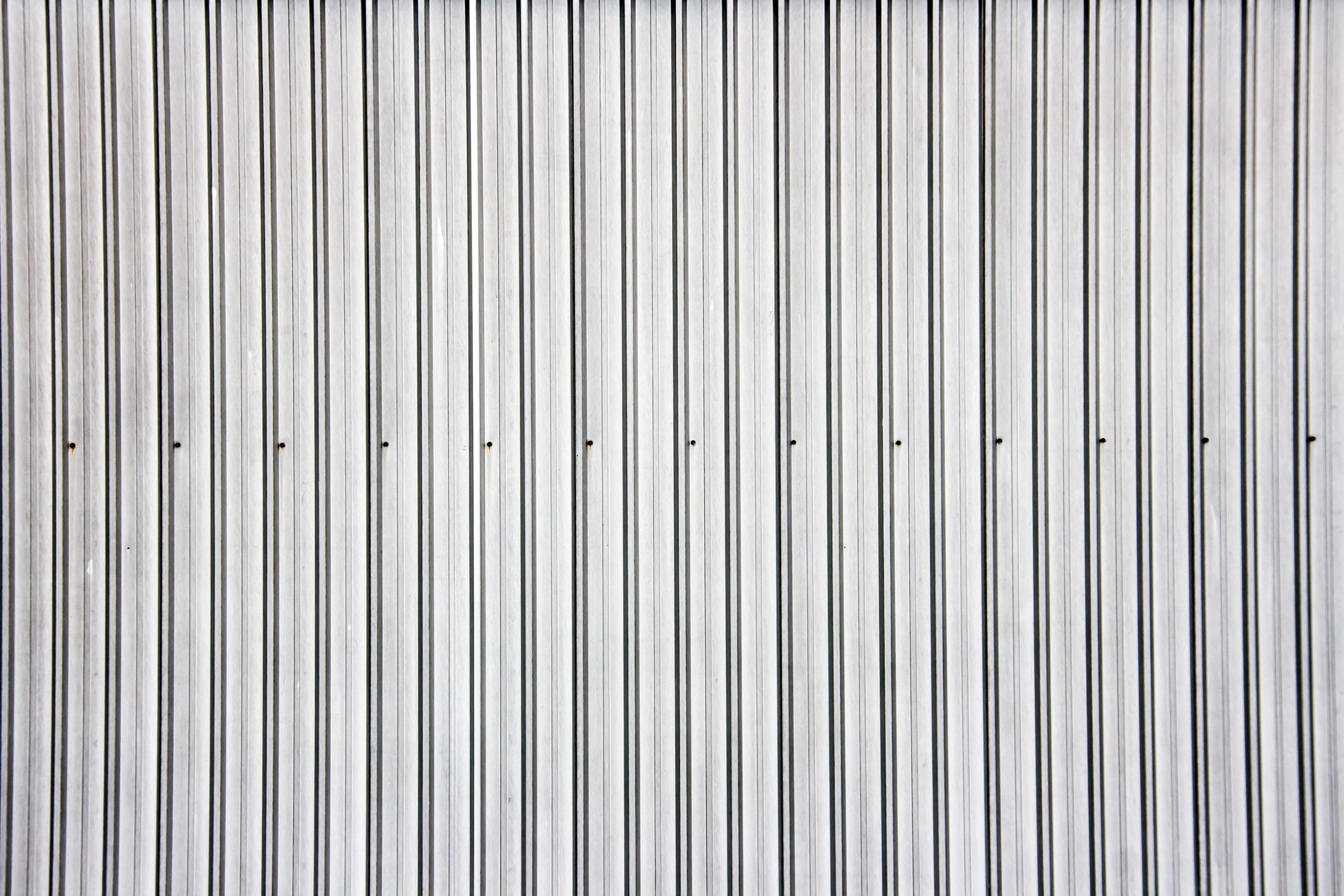 Silver corrugated metal wall texture